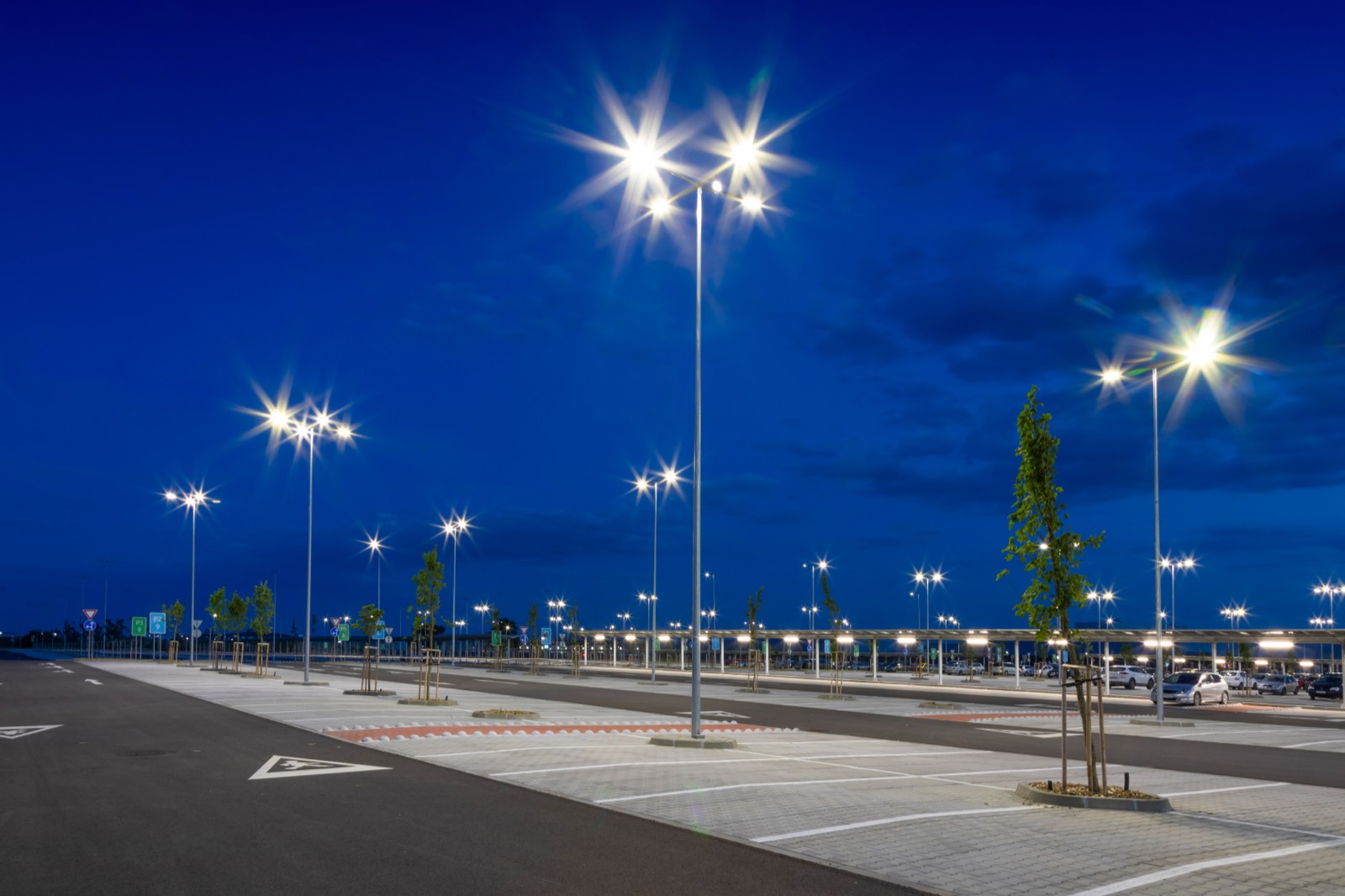 Illuminated municipal parking-lot infrastructure at night